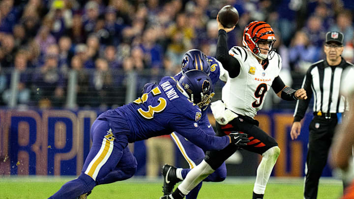 Baltimore Ravens outside linebacker Odafe Oweh (99) and Baltimore Ravens outside linebacker Kyle Van Noy (53) force Cincinnati Bengals quarterback Joe Burrow (9) out of the pocket =in the fourth quarter of the NFL game at M&T Banks Stadium in Baltimore on Thursday, Nov. 7, 2024.