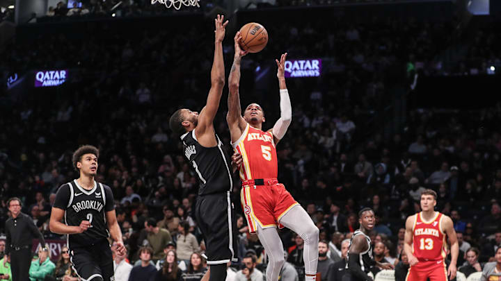 Mar 2, 2024; Brooklyn, New York, USA; Atlanta Hawks guard Dejounte Murray (5) shoots past Brooklyn Mar 2, 2024; Brooklyn, New York, USA; Atlanta Hawks guard Dejounte Murray (5) shoots past Brooklyn