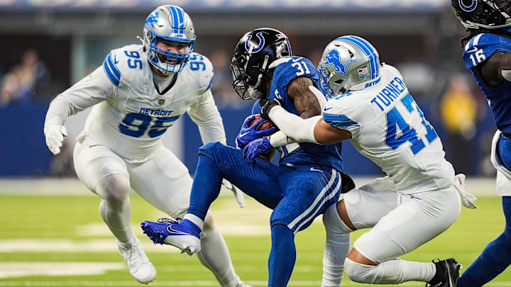 Detroit Lions linebacker Ezekiel Turner (47), right, and defensive end Pat O'Connor (95) against Indianapolis Colts