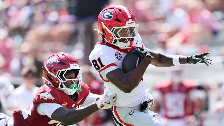 Sep 19, 2026; Fayetteville, Arkansas, USA; Georgia Bulldogs wide receiver Craig Dandridge (81) runs with the ball against Arkansas Razorbacks defensive back Brylan Green (34) during the second half at Donald W. Reynolds Razorback Stadium. Mandatory Credit: Nelson Chenault-Imagn Images Sep 19, 2026; Fayetteville, Arkansas, USA; Georgia Bulldogs wide receiver Craig Dandridge (81) runs with the ball against Arkansas Razorbacks defensive back Brylan Green (34) during the second half at Donald W. Reynolds Razorback Stadium. Mandatory Credit: Nelson Chenault-Imagn Images