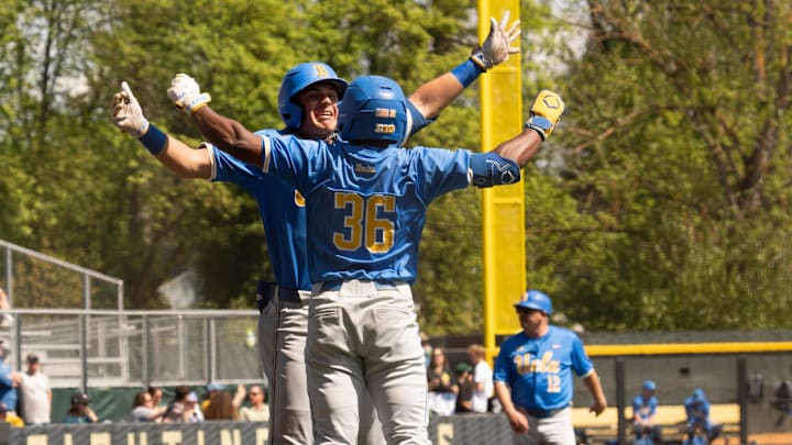 UCLA’s Dean West, left, celebrates his first-inning home run with teammate Roman Martin at PK Park in Eugene.