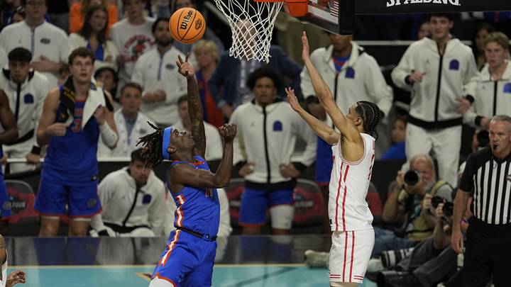 Apr 7, 2025; San Antonio, TX, USA; Florida Gators guard Denzel Aberdeen (11) shoots the ball over Houston Cougars guard Milos Uzan (7) during the second half in the national championship game of the Final Four of the 2025 NCAA Tournament at the Alamodome.Mandatory Credit: Scott Wachter-Imagn Images Apr 7, 2025; San Antonio, TX, USA; Florida Gators guard Denzel Aberdeen (11) shoots the ball over Houston Cougars guard Milos Uzan (7) during the second half in the national championship game of the Final Four of the 2025 NCAA Tournament at the Alamodome.Mandatory Credit: Scott Wachter-Imagn Images