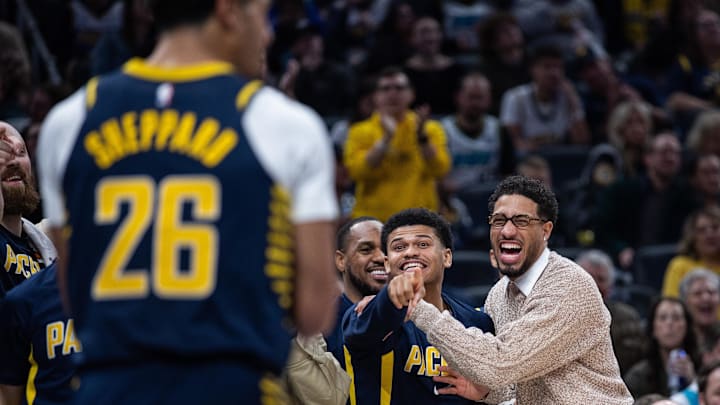 Nov 19, 2025; Indianapolis, Indiana, USA; Indiana Pacers guard RayJ Dennis (10) and guard Tyrese Haliburton (0) react to a basket in the second half against the Charlotte Hornets at Gainbridge Fieldhouse. Mandatory Credit: Trevor Ruszkowski-Imagn Images