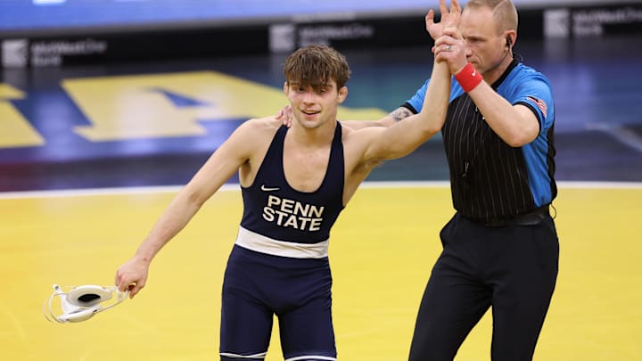 Penn State Nittany Lions wrestler Marcus Blaze gets his hand raised after a win over the Iowa Hawkeyes' Drake Ayala at Carver-Hawkeye Arena. 