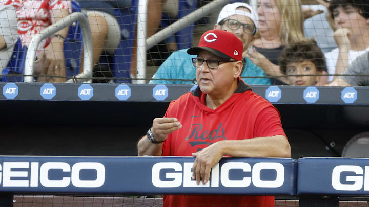 Apr 22, 2025; Miami, Florida, USA;  Cincinnati Reds manager Terry Francona (77) watches the game against the Miami Marlins from the dugout during the second inning at loanDepot Park. Mandatory Credit: Rhona Wise-Imagn Images