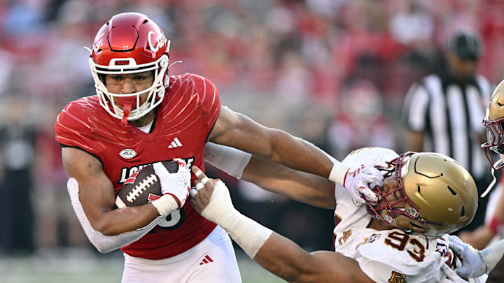 Sep 23, 2023; Louisville, Kentucky, USA; Louisville Cardinals running back Isaac Guerendo (23) runs the ball against Boston College Eagles defensive tackle Owen Stoudmire (93) during the second half at L&N Federal Credit Union Stadium. Louisville defeated Boston College 56-28. Mandatory Credit: Jamie Rhodes-Imagn Images Sep 23, 2023; Louisville, Kentucky, USA; Louisville Cardinals running back Isaac Guerendo (23) runs the ball against Boston College Eagles defensive tackle Owen Stoudmire (93) during the second half at L&N Federal Credit Union Stadium. Louisville defeated Boston College 56-28. Mandatory Credit: Jamie Rhodes-Imagn Images