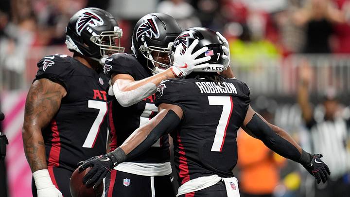 Sep 28, 2025; Atlanta, Georgia, USA; Atlanta Falcons running back Bijan Robinson (7) celebrates with wide receiver Drake London (5) after scoring a touchdown during the first half against the Washington Commanders at Mercedes-Benz Stadium. Mandatory Credit: Dale Zanine-Imagn Images