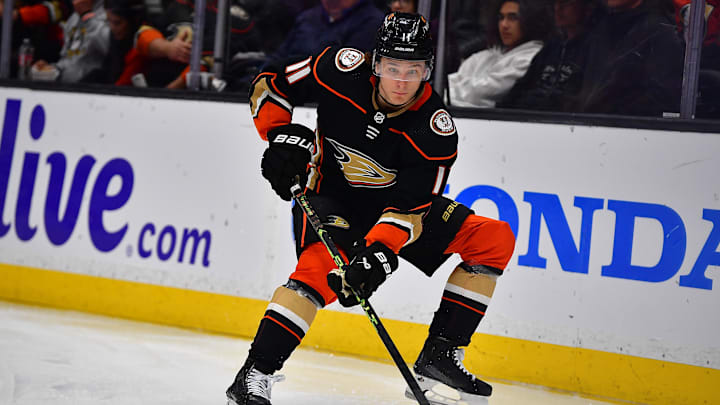 Mar 21, 2023; Anaheim, California, USA; Anaheim Ducks center Trevor Zegras (11) controls the puck against the Calgary Flames during the third period at Honda Center. Mandatory Credit: Gary A. Vasquez-USA TODAY Sports