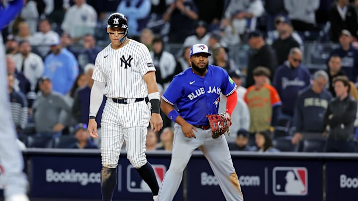Oct 8, 2025; Bronx, New York, USA; New York Yankees right fielder Aaron Judge (99) stands on first base with Toronto Blue Jays first baseman Vladimir Guerrero Jr. (27) during the ninth inning during game four of the ALDS round for the 2025 MLB playoffs at Yankee Stadium. Mandatory Credit: Brad Penner-Imagn Images Oct 8, 2025; Bronx, New York, USA; New York Yankees right fielder Aaron Judge (99) stands on first base with Toronto Blue Jays first baseman Vladimir Guerrero Jr. (27) during the ninth inning during game four of the ALDS round for the 2025 MLB playoffs at Yankee Stadium. Mandatory Credit: Brad Penner-Imagn Images