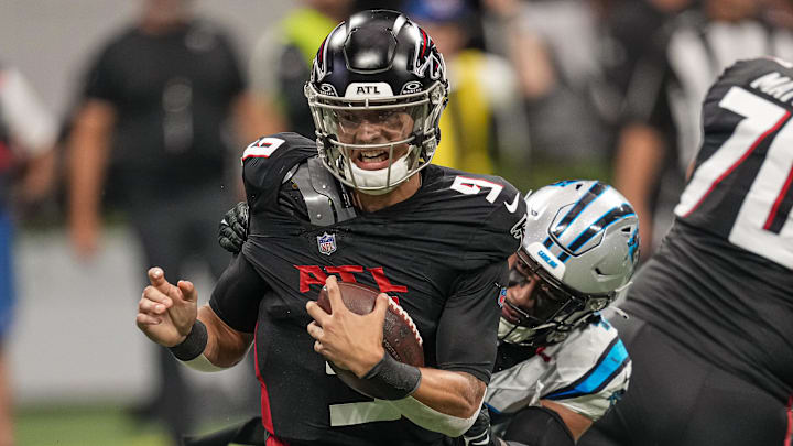 Sep 10, 2023; Atlanta, Georgia, USA; Atlanta Falcons quarterback Desmond Ridder (9) tries to escape