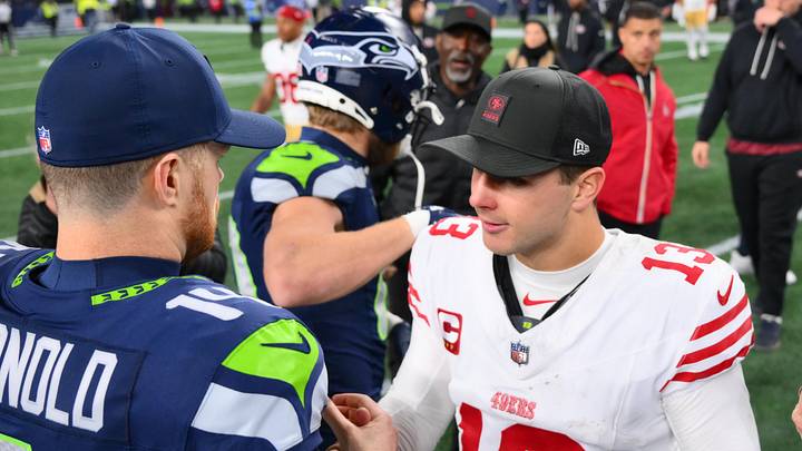 Jan 17, 2026; Seattle, WA, USA; Seattle Seahawks quarterback Sam Darnold (14) and San Francisco 49ers quarterback Brock Purdy (13) shake hands following an NFC Divisional Round game at Lumen Field. Mandatory Credit: Steven Bisig-Imagn Images