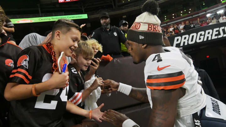 Aug 11, 2023; Cleveland, Ohio, USA; Cleveland Browns quarterback Deshaun Watson (4) signs an autograph after the game against the Washington Commanders at Cleveland Browns Stadium. Mandatory Credit: Ken Blaze-USA TODAY Sports Aug 11, 2023; Cleveland, Ohio, USA; Cleveland Browns quarterback Deshaun Watson (4) signs an autograph after the game against the Washington Commanders at Cleveland Browns Stadium. Mandatory Credit: Ken Blaze-USA TODAY Sports