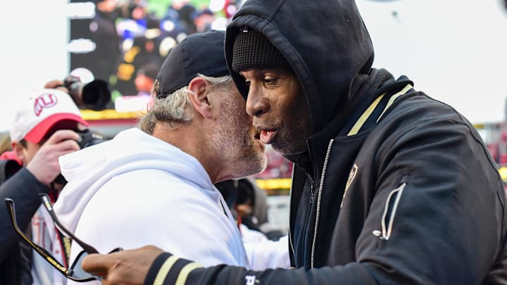 Nov 25, 2023; Salt Lake City, Utah, USA; Colorado Buffaloes head coach Deion 'Coach Prime' Sanders congratulates Utah Utes head coach Kyle Whittingham after the Utah Utes victory over the Colorado Buffaloes at Rice-Eccles Stadium. Mandatory Credit: Christopher Creveling-Imagn Images Nov 25, 2023; Salt Lake City, Utah, USA; Colorado Buffaloes head coach Deion 'Coach Prime' Sanders congratulates Utah Utes head coach Kyle Whittingham after the Utah Utes victory over the Colorado Buffaloes at Rice-Eccles Stadium. Mandatory Credit: Christopher Creveling-Imagn Images