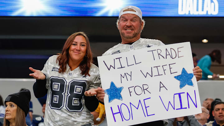 Dallas Cowboys fans hold a sign prior to the game against the New York Giants.