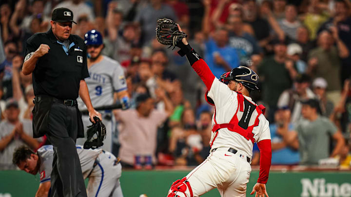 Aug 4, 2025; Boston, Massachusetts, USA; Kansas City Royals outfielder Nick Loftin (12) tagged out at home plate by Boston Red Sox catcher Connor Wong (12) to end the eighth inning at Fenway Park. Mandatory Credit: David Butler II-Imagn Images