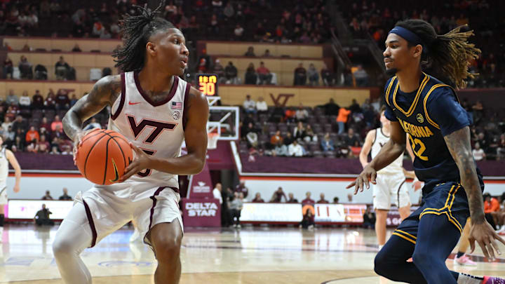 Jan 10, 2026; Blacksburg, Virginia, USA;  Virginia Tech Hokies guard Ben Hammond (3) looks to pass as California Golden Bears forward Chris Bell (22) defends during the second half at Cassell Coliseum. Mandatory Credit: Brian Bishop-Imagn Images