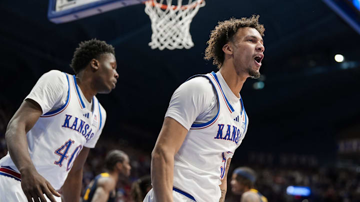 Dec 31, 2024; Lawrence, Kansas, USA; Kansas Jayhawks guard Zeke Mayo (5) reacts after scoring during the second half against the West Virginia Mountaineers at Allen Fieldhouse. Mandatory Credit: Jay Biggerstaff-Imagn Images