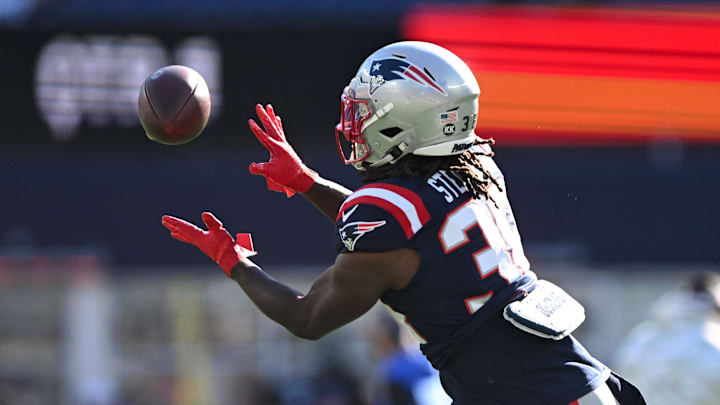 Nov 17, 2024; Foxborough, Massachusetts, USA; New England Patriots running back Rhamondre Stevenson (38) makes a catch before a game against the Los Angeles Rams at Gillette Stadium. 
