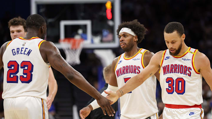 Feb 27, 2025; Orlando, Florida, USA; Golden State Warriors guard Stephen Curry (30) and forward Draymond Green (23) celebrate after a play against the Orlando Magic in the third quarter at Kia Center. Mandatory Credit: Nathan Ray Seebeck-Imagn Images