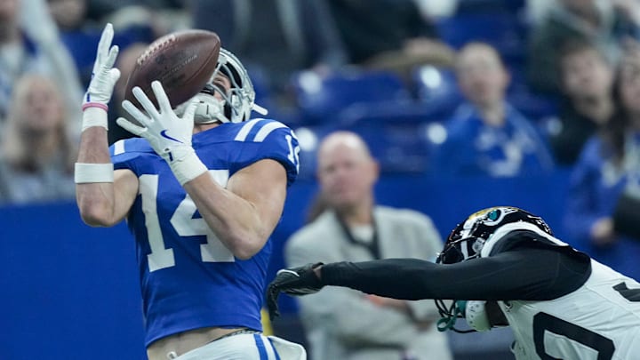 Indianapolis Colts wide receiver Alec Pierce (14) makes a catch for a touchdown in front of Jacksonville Jaguars cornerback Montaric Brown (30) on Sunday, Jan. 5, 2025, during a game against the Jacksonville Jaguars at Lucas Oil Stadium in Indianapolis.