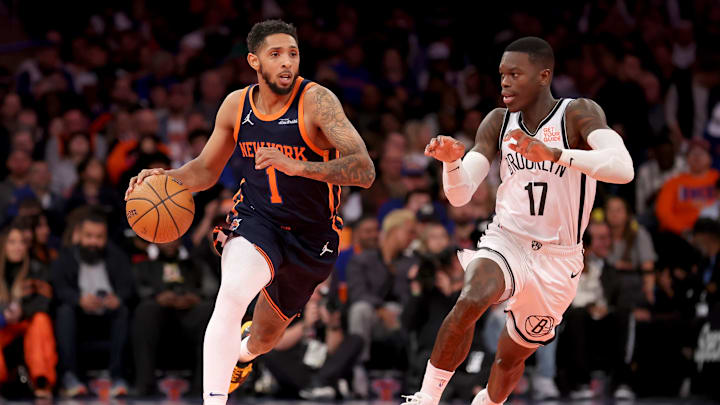 Nov 15, 2024; New York, New York, USA; New York Knicks guard Cameron Payne (1) brings the ball up court against Brooklyn Nets guard Dennis Schroder (17) during the fourth quarter at Madison Square Garden. Mandatory Credit: Brad Penner-Imagn Images