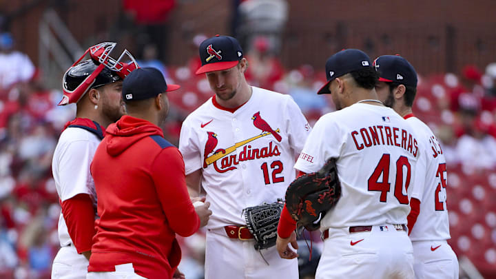 Apr 27, 2025; St. Louis, Missouri, USA;  St. Louis Cardinals starting pitcher Erick Fedde (12) is removed from the game by manager Oliver Marmol (37) during the sixth inning against the Milwaukee Brewers at Busch Stadium. Mandatory Credit: Jeff Curry-Imagn Images