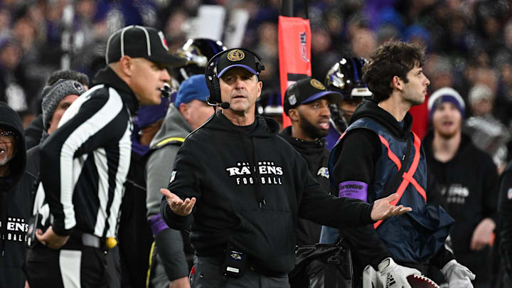 Jan 28, 2024; Baltimore, Maryland, USA; Baltimore Ravens head coach John Harbaugh (center) questions