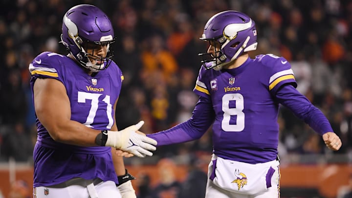 Kirk Cousins and Christian Darrisaw