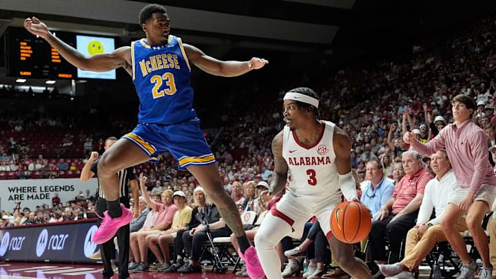 Nov 11, 2024; Tuscaloosa, AL, USA; McNeese guard Brandon Murray (23) leaps after a fake by Alabama guard Latrell Wrightsell Jr. (3) at Coleman Coliseum. Mandatory Credit: Gary Cosby Jr.-Tuscaloosa News Nov 11, 2024; Tuscaloosa, AL, USA; McNeese guard Brandon Murray (23) leaps after a fake by Alabama guard Latrell Wrightsell Jr. (3) at Coleman Coliseum. Mandatory Credit: Gary Cosby Jr.-Tuscaloosa News