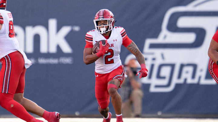 Sep 14, 2024; Logan, Utah, USA; Utah Utes running back Micah Bernard (2) runs with the ball against the Utah State Aggies at Merlin Olsen Field at Maverik Stadium. Mandatory Credit: Jamie Sabau-Imagn Images Sep 14, 2024; Logan, Utah, USA; Utah Utes running back Micah Bernard (2) runs with the ball against the Utah State Aggies at Merlin Olsen Field at Maverik Stadium. Mandatory Credit: Jamie Sabau-Imagn Images