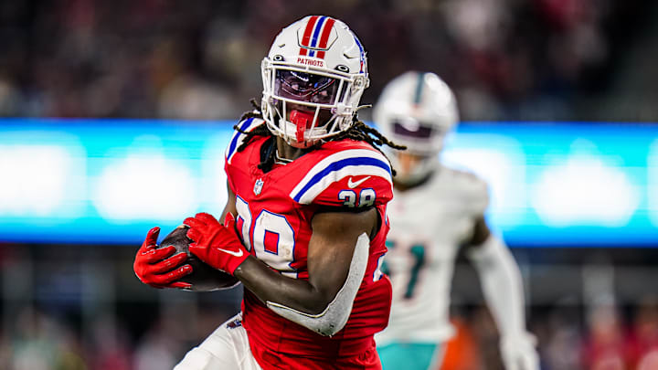 Sep 17, 2023; Foxborough, Massachusetts, USA; New England Patriots running back Rhamondre Stevenson (38) runs the ball against the Miami Dolphins in the second half at Gillette Stadium.