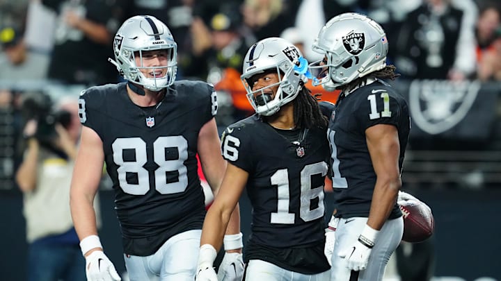 Jan 7, 2024; Paradise, Nevada, USA; Las Vegas Raiders wide receiver Jakobi Meyers (16) celebrates with Las Vegas Raiders tight end Zach Gentry (88) and Las Vegas Raiders wide receiver Tre Tucker (11) at Allegiant Stadium. Mandatory Credit: Stephen R. Sylvanie-Imagn Images