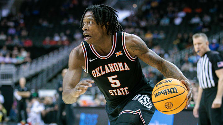 Mar 12, 2024; Kansas City, MO, USA; Oklahoma State Cowboys guard Quion Williams (5) drives to the