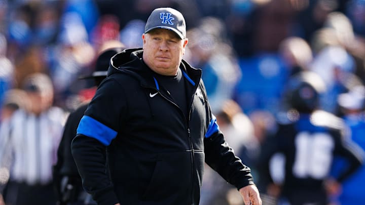 Nov 30, 2024; Lexington, Kentucky, USA; Kentucky Wildcats head coach Mark Stoops walks onto the field before the game against the Louisville Cardinals at Kroger Field. Mandatory Credit: Jordan Prather-Imagn Images