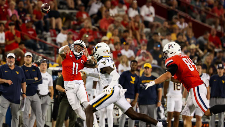 Oct 26, 2024; Tucson, Arizona, USA; Arizona Wildcats quarterback Noah Fifita (11) throws the ball during the fourth quarter against the West Virginia Mountaineers at Arizona Stadium. Mandatory Credit: Aryanna Frank-Imagn Images