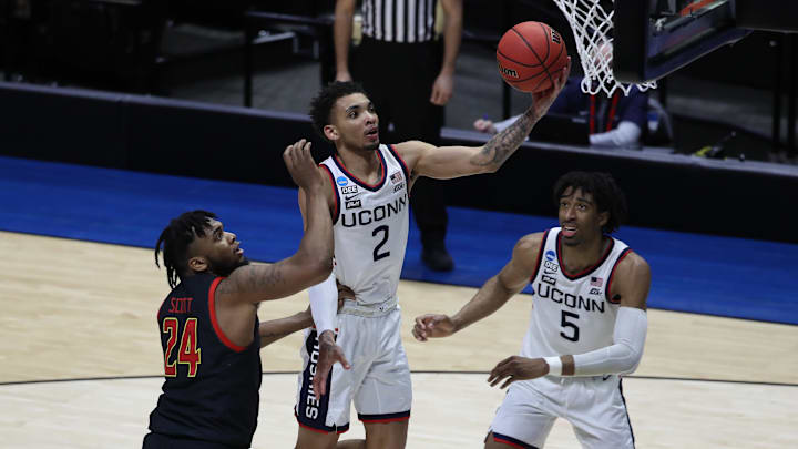 Mar 20, 2021; West Lafayette, Indiana, USA; Connecticut Huskies guard James Bouknight (2) shoots the ball over Maryland Terrapins forward Donta Scott (24) as Connecticut forward Isaiah Whaley (5) looks on during the second half in the first round of the 2021 NCAA Tournament at Mackey Arena. Mandatory Credit: Joshua Bickel-Imagn Images Mar 20, 2021; West Lafayette, Indiana, USA; Connecticut Huskies guard James Bouknight (2) shoots the ball over Maryland Terrapins forward Donta Scott (24) as Connecticut forward Isaiah Whaley (5) looks on during the second half in the first round of the 2021 NCAA Tournament at Mackey Arena. Mandatory Credit: Joshua Bickel-Imagn Images