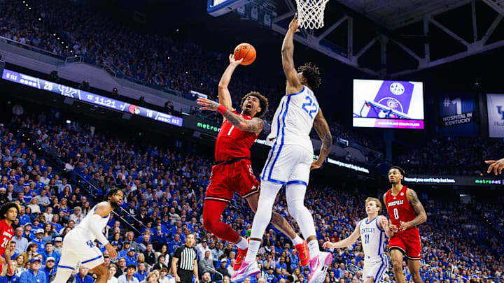 Dec 14, 2024; Lexington, Kentucky, USA; Louisville Cardinals guard J'Vonne Hadley (1) goes to the basket against Kentucky Wildcats center Amari Williams (22) during the first half at Rupp Arena at Central Bank Center. Mandatory Credit: Jordan Prather-Imagn Images
