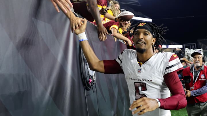 Sep 23, 2024; Cincinnati, Ohio, USA; Washington Commanders quarterback Jayden Daniels (5) celebrates with fans following the win against the Cincinnati Bengals at Paycor Stadium. Mandatory Credit: Joseph Maiorana-Imagn Images Sep 23, 2024; Cincinnati, Ohio, USA; Washington Commanders quarterback Jayden Daniels (5) celebrates with fans following the win against the Cincinnati Bengals at Paycor Stadium. Mandatory Credit: Joseph Maiorana-Imagn Images