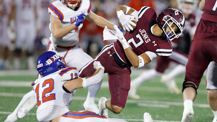 Bixby's Cooper Parker brings down Jenks' Kaydin Jones during the Class 6A-1 high school football championship game between Bixby and Jenks at Chad Richison Stadium in Edmond, Okla., Friday, Dec. 1, 2023.