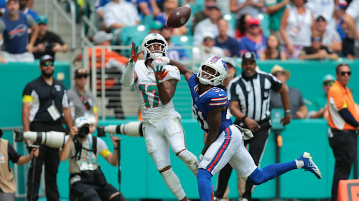 Nov 9, 2025; Miami Gardens, Florida, USA; Miami Dolphins wide receiver Jaylen Waddle (17) makes a touchdown catch against Buffalo Bills cornerback Maxwell Hairston (31) during the first half at Hard Rock Stadium
