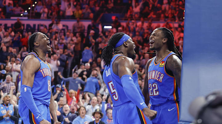 Apr 8, 2025; Oklahoma City, Oklahoma, USA; Oklahoma City Thunder forward Jalen Williams (8), guard Luguentz Dort (5) celebrate with guard Cason Wallace (22) after he made a basket against the Los Angeles Lakers during the second half at Paycom Center. Mandatory Credit: Alonzo Adams-Imagn Images
