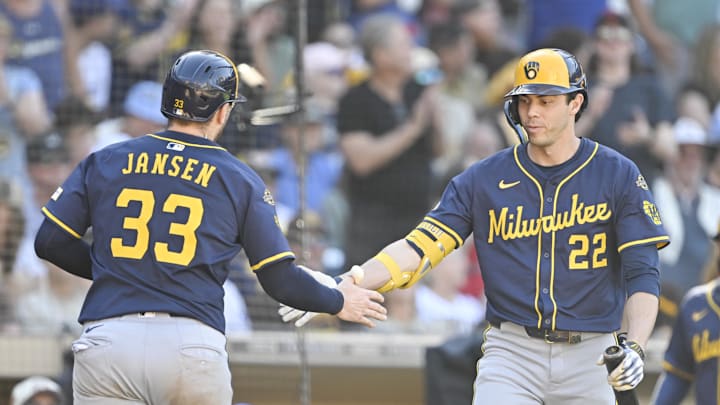 Sep 24, 2025; San Diego, California, USA; Milwaukee Brewers catcher Danny Jansen (33) is congratulated by Christian Yelich (22) after hitting a solo home run during the ninth inning against the San Diego Padres at Petco Park. Mandatory Credit: Denis Poroy-Imagn Images