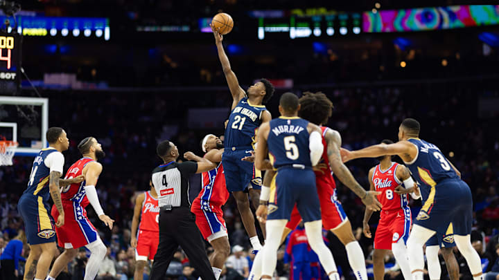 Jan 10, 2025; Philadelphia, Pennsylvania, USA; New Orleans Pelicans center Yves Missi (21) wins the opening tip off against Philadelphia 76ers forward Guerschon Yabusele (28) at Wells Fargo Center. Mandatory Credit: Bill Streicher-Imagn Images