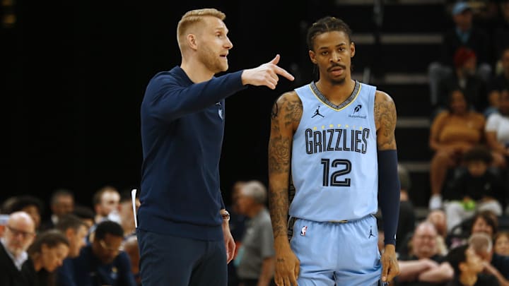 Mar 31, 2025; Memphis, Tennessee, USA; Memphis Grizzlies interim head coach Tuomas Iisalo talks with Memphis Grizzlies guard Ja Morant (12) during the third quarter against the Boston Celtics at FedExForum. Mandatory Credit: Petre Thomas-Imagn Images