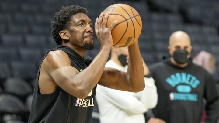 Jan 10, 2022; Charlotte, North Carolina, USA; Milwaukee Bucks guard Langston Galloway (12) during pregame warm ups against the Charlotte Hornets at the Spectrum Center. Mandatory Credit: Jim Dedmon-USA TODAY Sports
