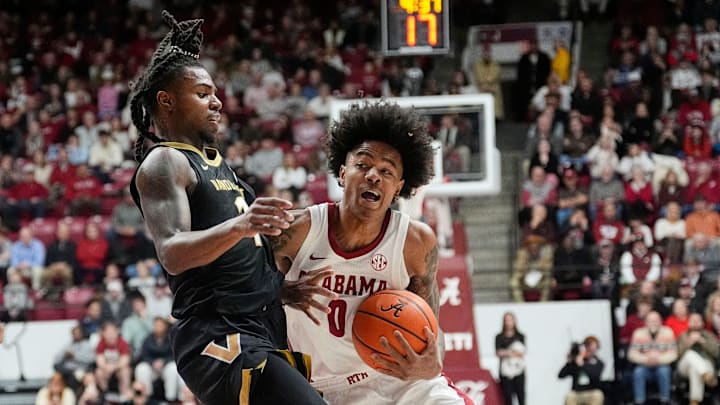 Jan 21, 2025; Tuscaloosa, AL, USA; Vanderbilt guard Jason Edwards (1) defends the lane as Alabama guard Labaron Philon (0) attempts a drive at Coleman Coliseum. 