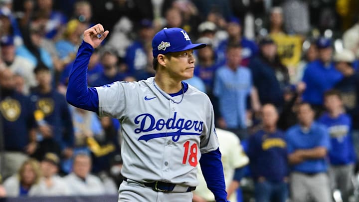 Oct 14, 2025; Milwaukee, Wisconsin, USA; Los Angeles Dodgers pitcher Yoshinobu Yamamoto (18) reacts after game two of the NLCS round against the Milwaukee Brewers for the 2025 MLB playoffs at American Family Field. Mandatory Credit: Benny Sieu-Imagn Images Oct 14, 2025; Milwaukee, Wisconsin, USA; Los Angeles Dodgers pitcher Yoshinobu Yamamoto (18) reacts after game two of the NLCS round against the Milwaukee Brewers for the 2025 MLB playoffs at American Family Field. Mandatory Credit: Benny Sieu-Imagn Images
