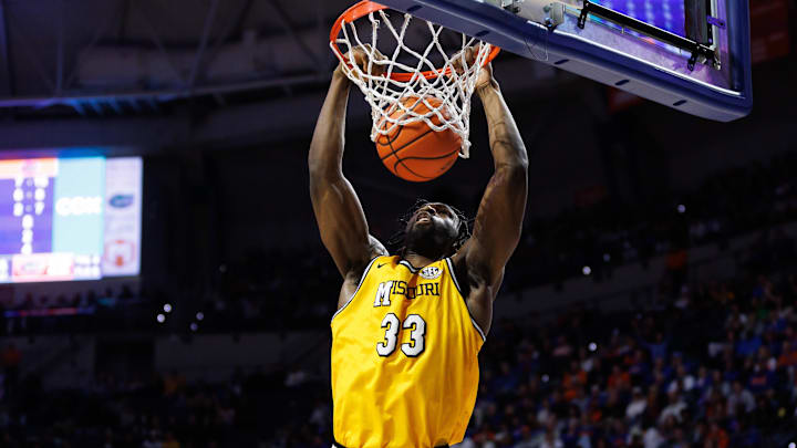 Jan 14, 2025; Gainesville, Florida, USA; Missouri Tigers center Josh Gray (33) dunks the ball against the Florida Gators during the first half at Exactech Arena at the Stephen C. O'Connell Center. Mandatory Credit: Matt Pendleton-Imagn Images