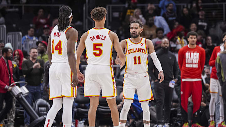 Feb 24, 2025; Atlanta, Georgia, USA; Atlanta Hawks guards Trae Young (11) and Dyson Daniels (5) react after the Hawks defeated the Miami Heat at State Farm Arena. Mandatory Credit: Dale Zanine-Imagn Images