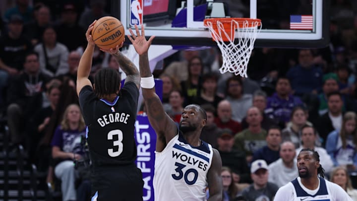 Jan 20, 2026; Salt Lake City, Utah, USA; Utah Jazz guard Keyonte George (3) shoots over Minnesota Timberwolves forward Julius Randle (30) during the second half at Delta Center. Mandatory Credit: Rob Gray-Imagn Images